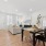 living room with a couch and a dining room with a table and chairs