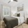 bedroom with lamps and a large window